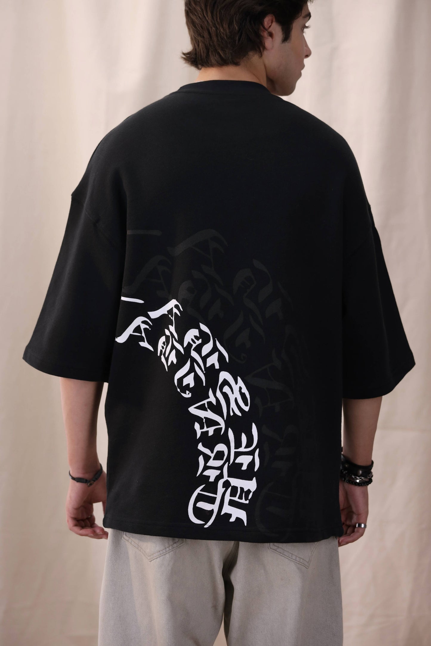 Arkaan black oversized drop shoulder unisex t-shirt by Shatrnj