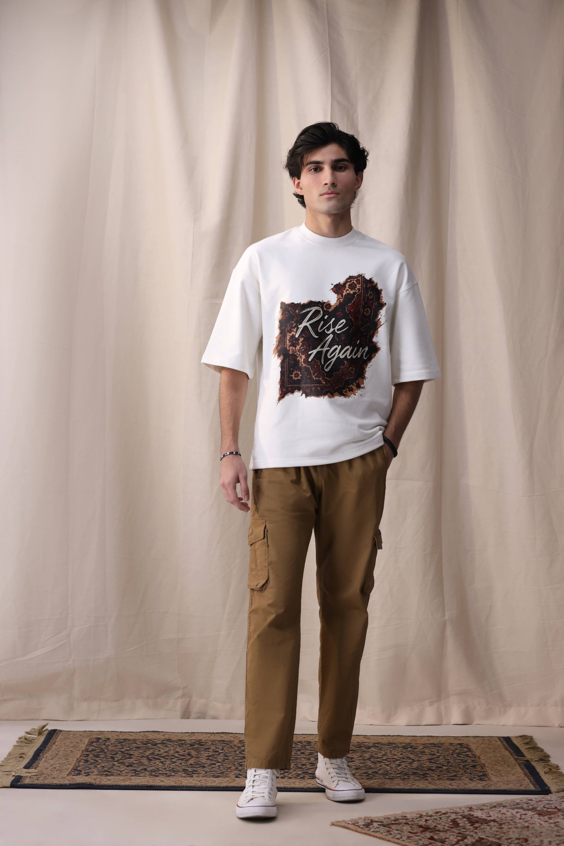 Model in Raah white oversized box fit unisex t-shirt by Shatrnj