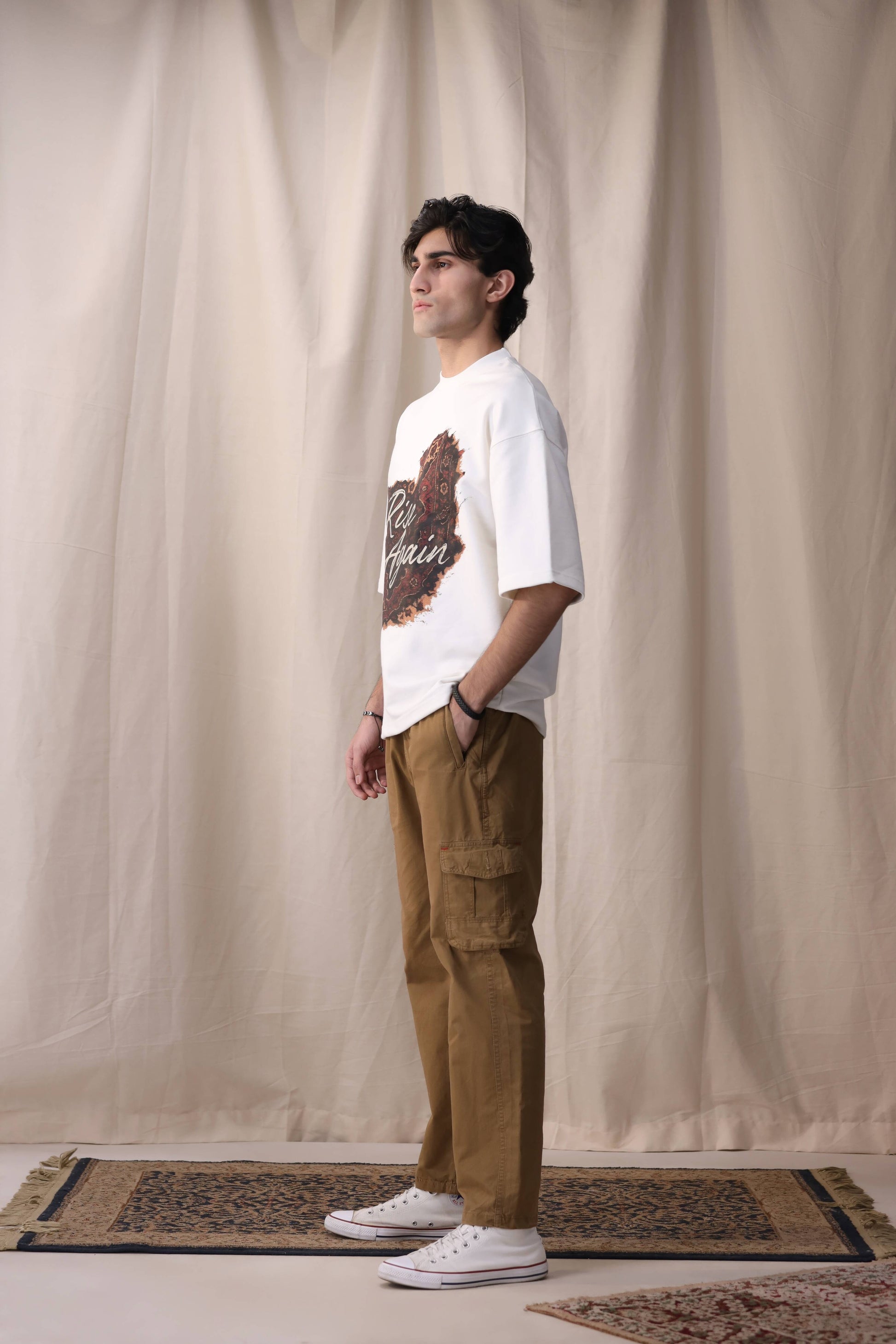 Model in Raah white oversized box fit unisex t-shirt by Shatrnj